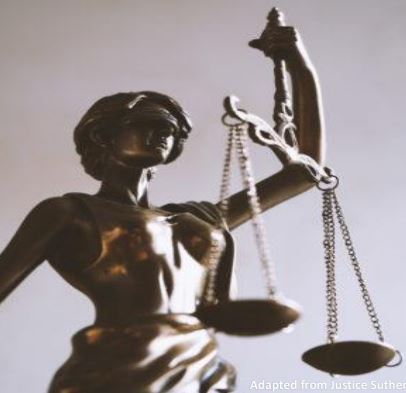 Statue of woman holding scales of justice.